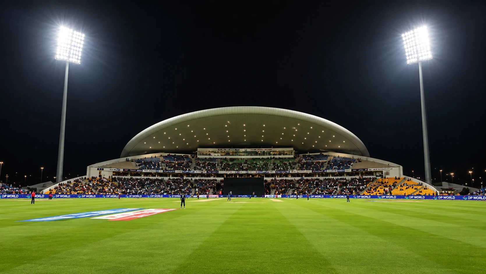Fans in the stands at Zayed Cricket Stadium